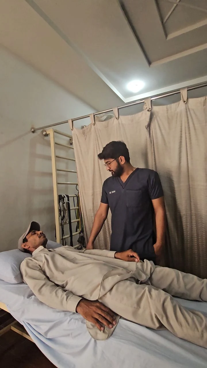 Physiotherapist guiding a patient through a personalized treatment session